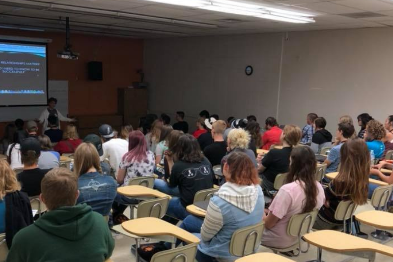 A group of students watching a lecture in a classroom