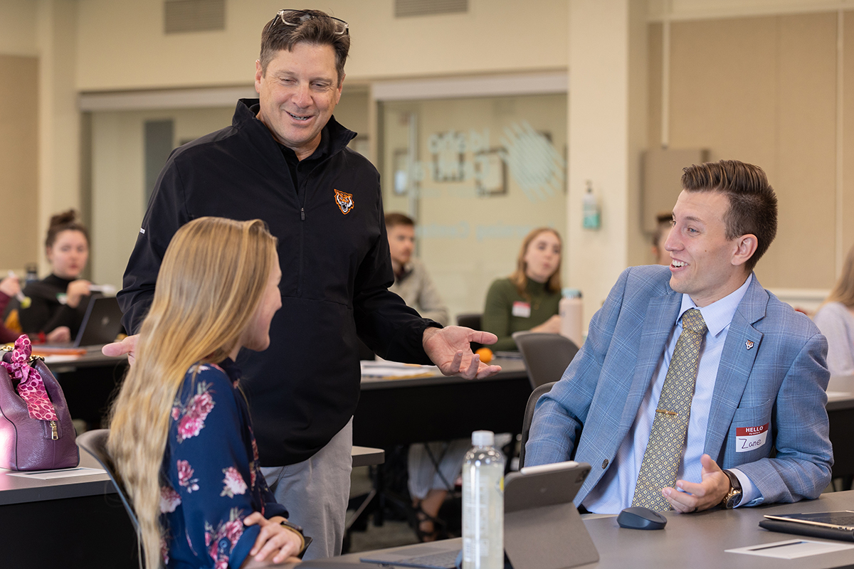 Students talking with a professor