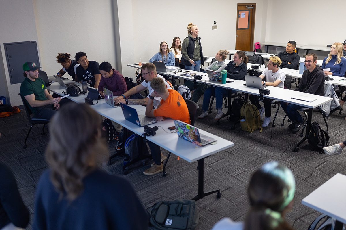 A student speaker to her peers in class