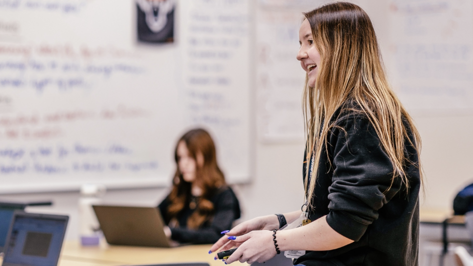An alumni teacher teaching a class