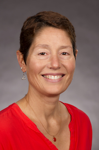 A woman with short hair smiling