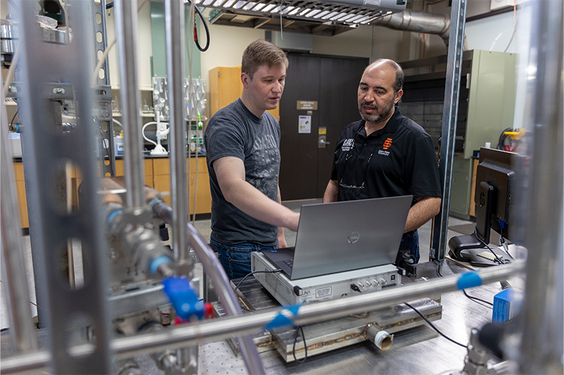 Scott Wahlquist, doctoral student, and Amir Ali, associate professor of nuclear engineering,  pose for a photo at the Center for Advanced Energy Studies in Idaho Falls.