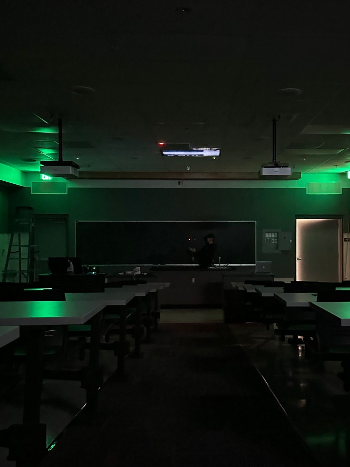 Two lit LEDs in a dark room