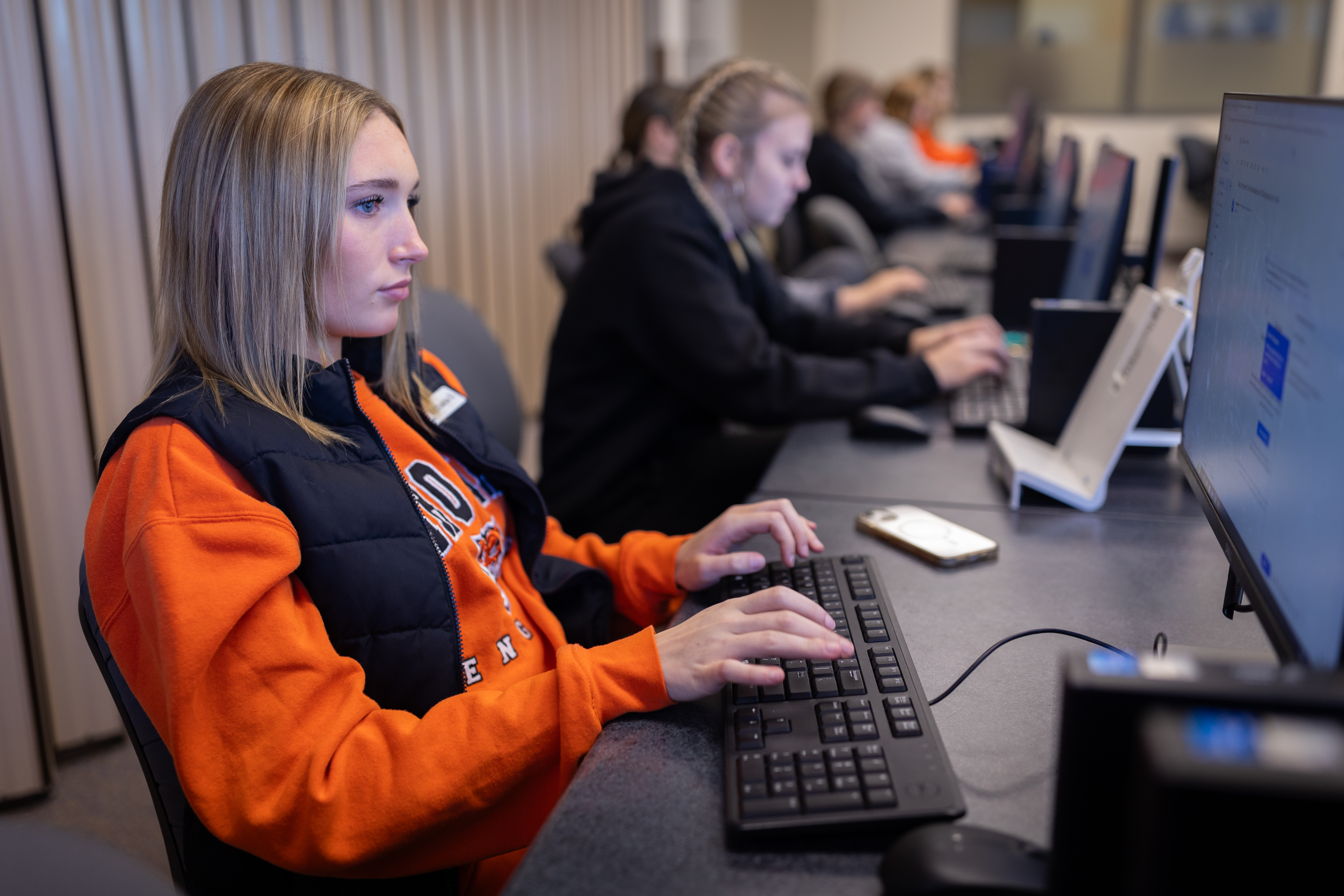 Business Technology students working on computers in the lab