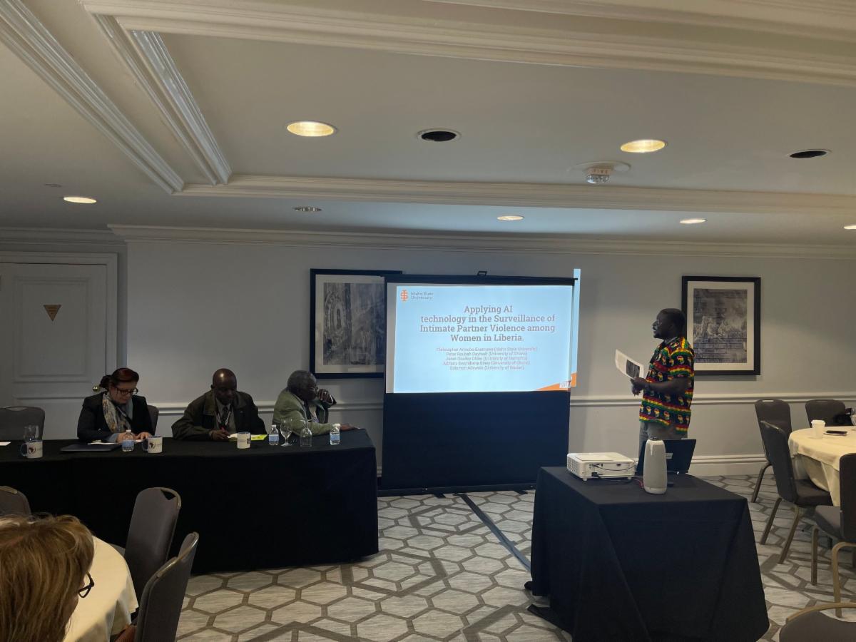 Christopher Amrobo Enemuwe presents his poster, 