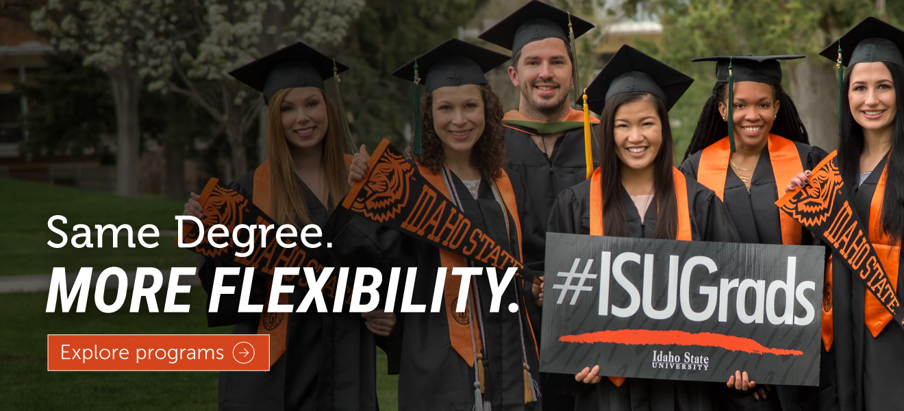 Group of Idaho State University graduates wearing caps and gowns, holding ISU scarves and a sign reading “#ISUGrads,” with on-screen text stating “Same Degree. More Flexibility.” and a button labeled “Explore programs.”