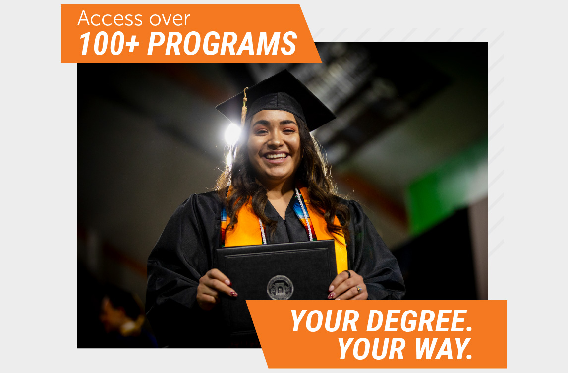 Smiling graduate wearing a black cap and gown holds a diploma during a commencement ceremony. Text on the image reads, “Access over 100+ programs” and “Your degree. Your way.”