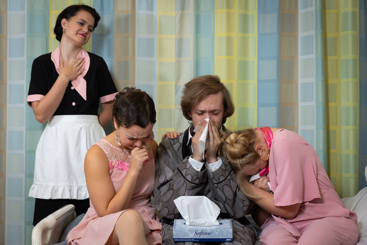 four people cry