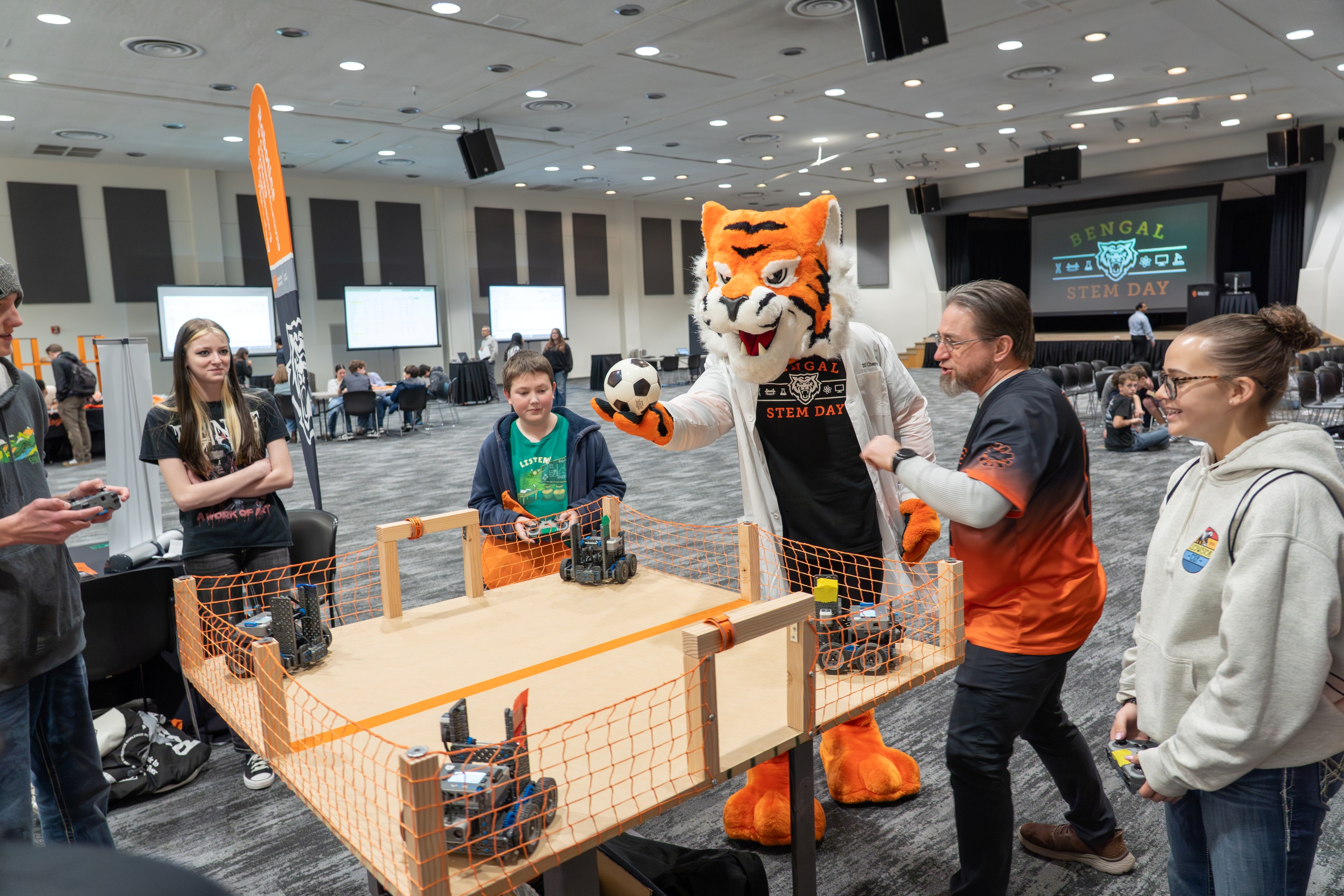 Benny the Bengal starts a robot soccer game at Bengal STEM Day 2026.