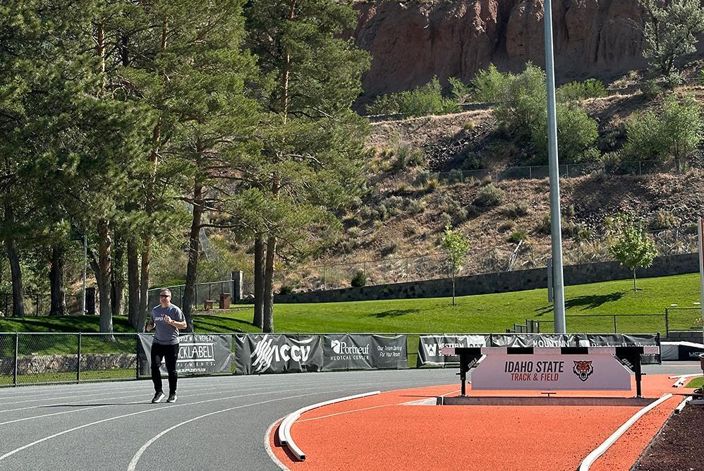 President Wagner running on the Davis Field track