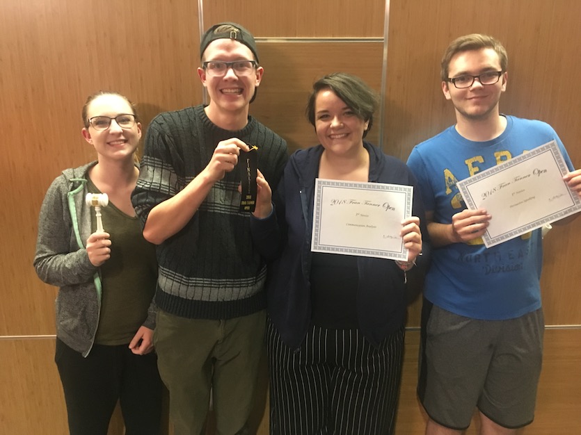 Photo of four Rupp Debate Society debaters who competed in Twin Falls.